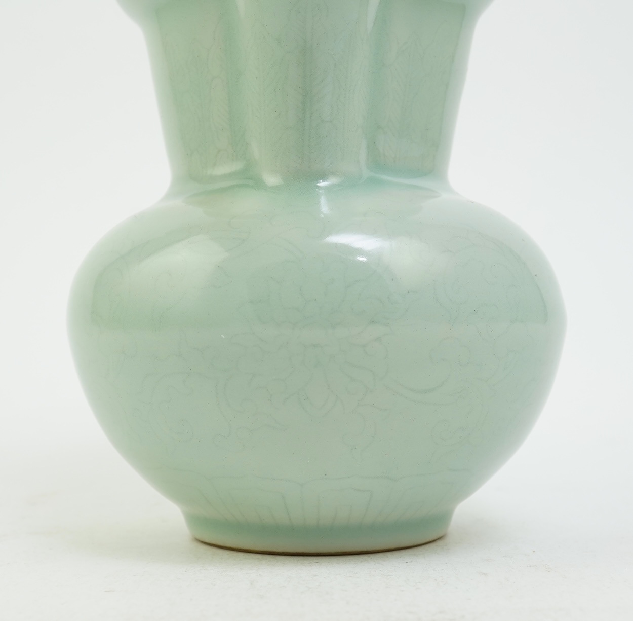 A Chinese incised celadon glazed monks cap ewer, Qianlong seal mark but later, 17cm